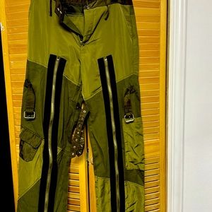 Army green  with black stripes on both legs ,buckles and pockets on leg